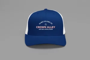 mockup of a trucker hat placed on a colorful surface